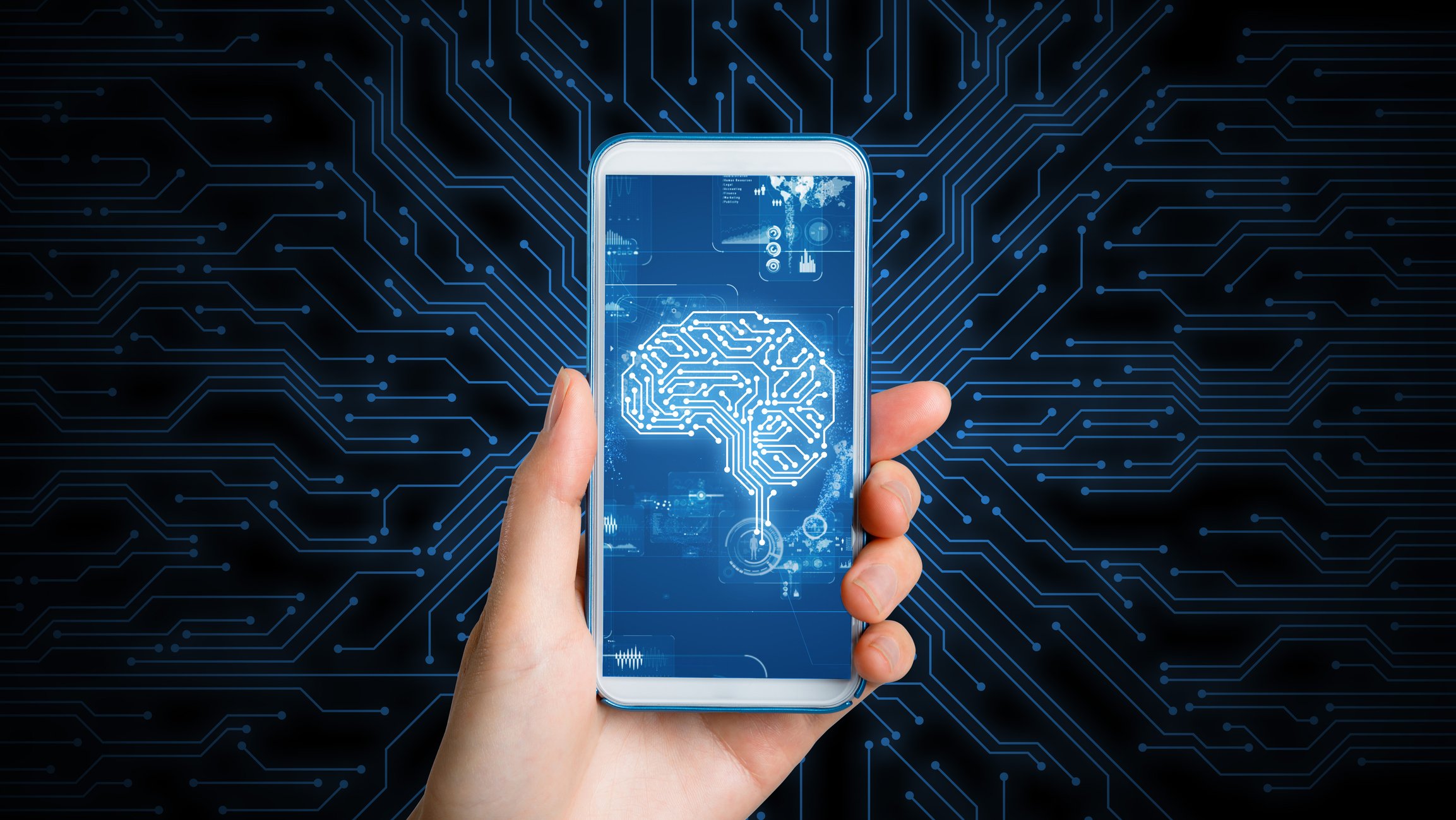 Closeup of phone screen with picture  of a human brain on it. 