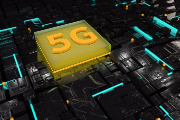 a processor labeled with 5G in a darkened circuit board. 