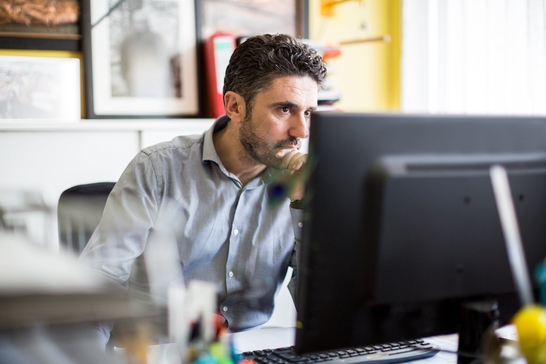Serious person at computer.