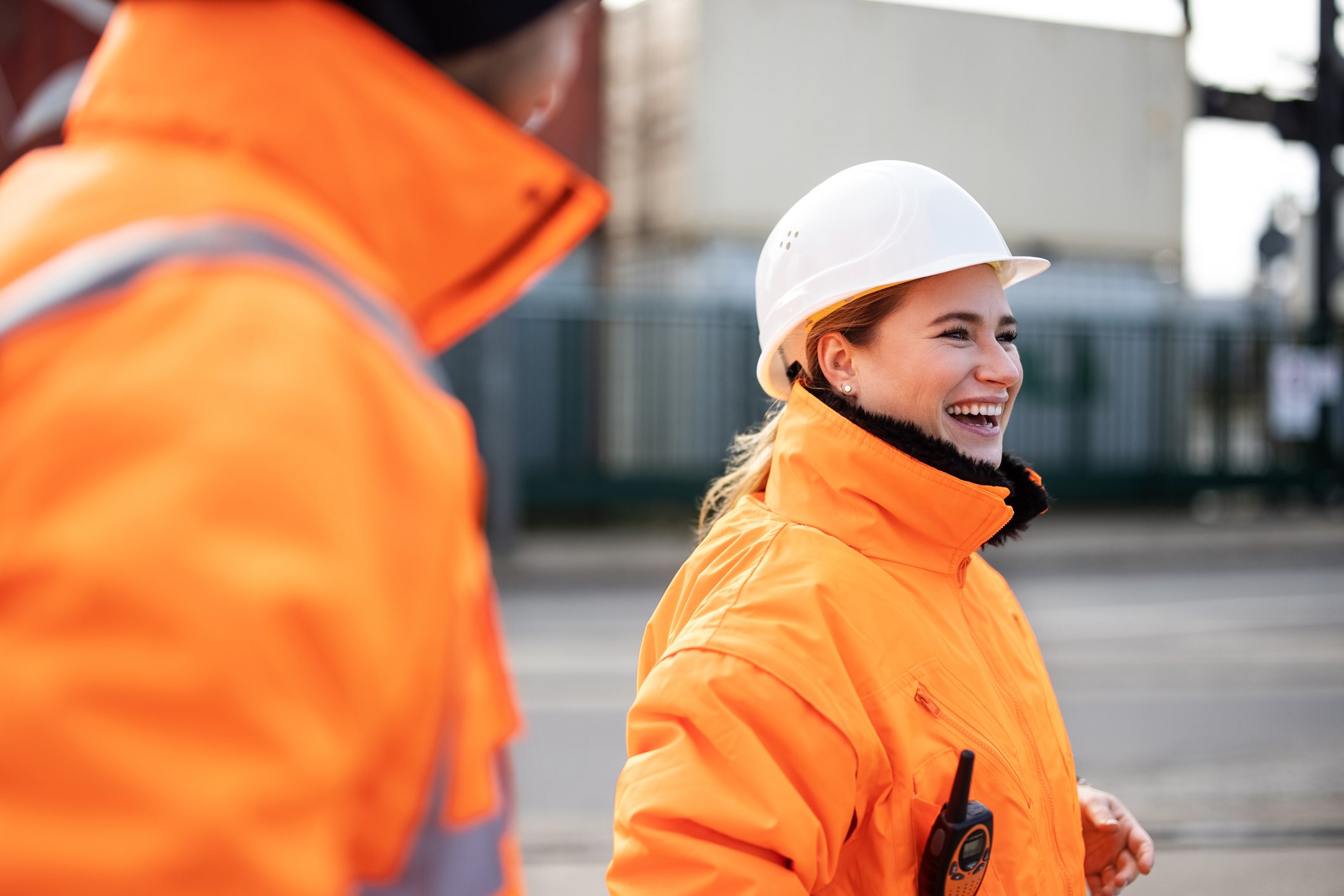 A person in a hardhat at a port.