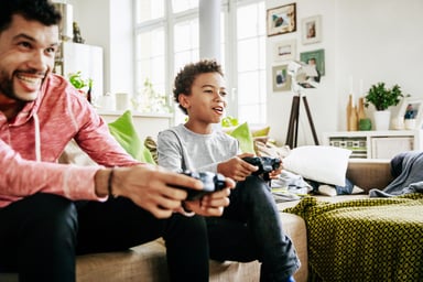 father playing video games with his son