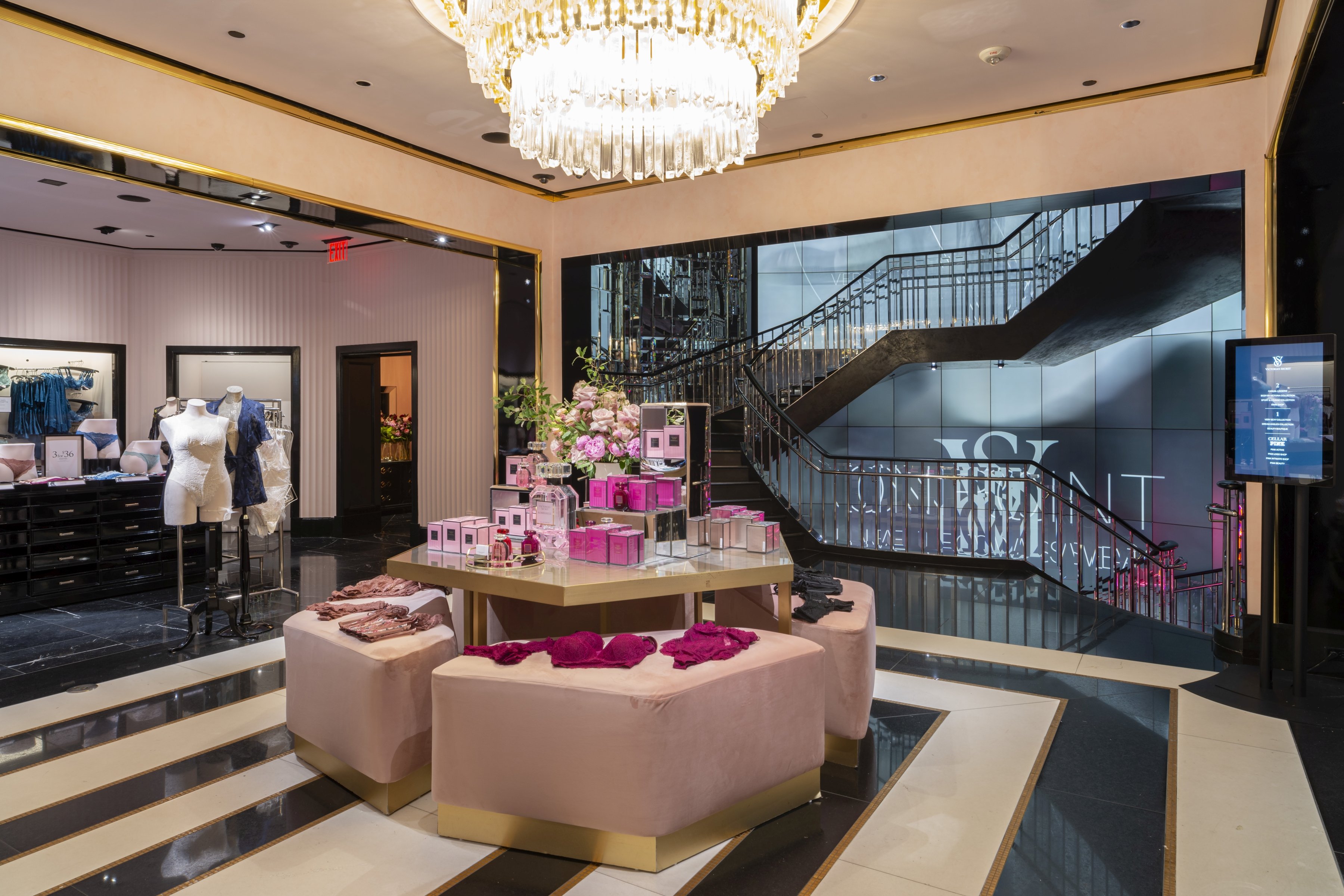 A fragrance display under a chandelier at Victoria's Secret's 5th Avenue location.