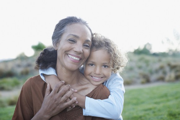 Grandson hugging his grandmother.