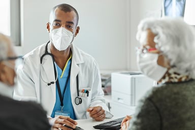 Doctor with two senior patients