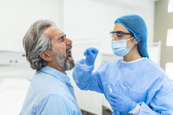 A patient getting a nasal swab at the clinic. 