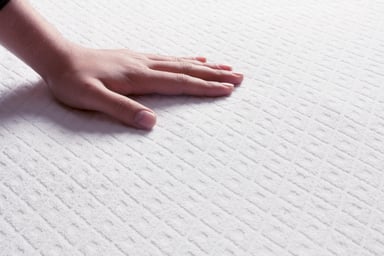 Person With Hand on a Matress
