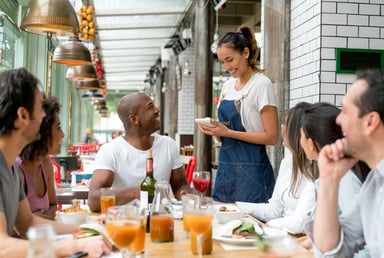 Waitress takes orders at restaurant