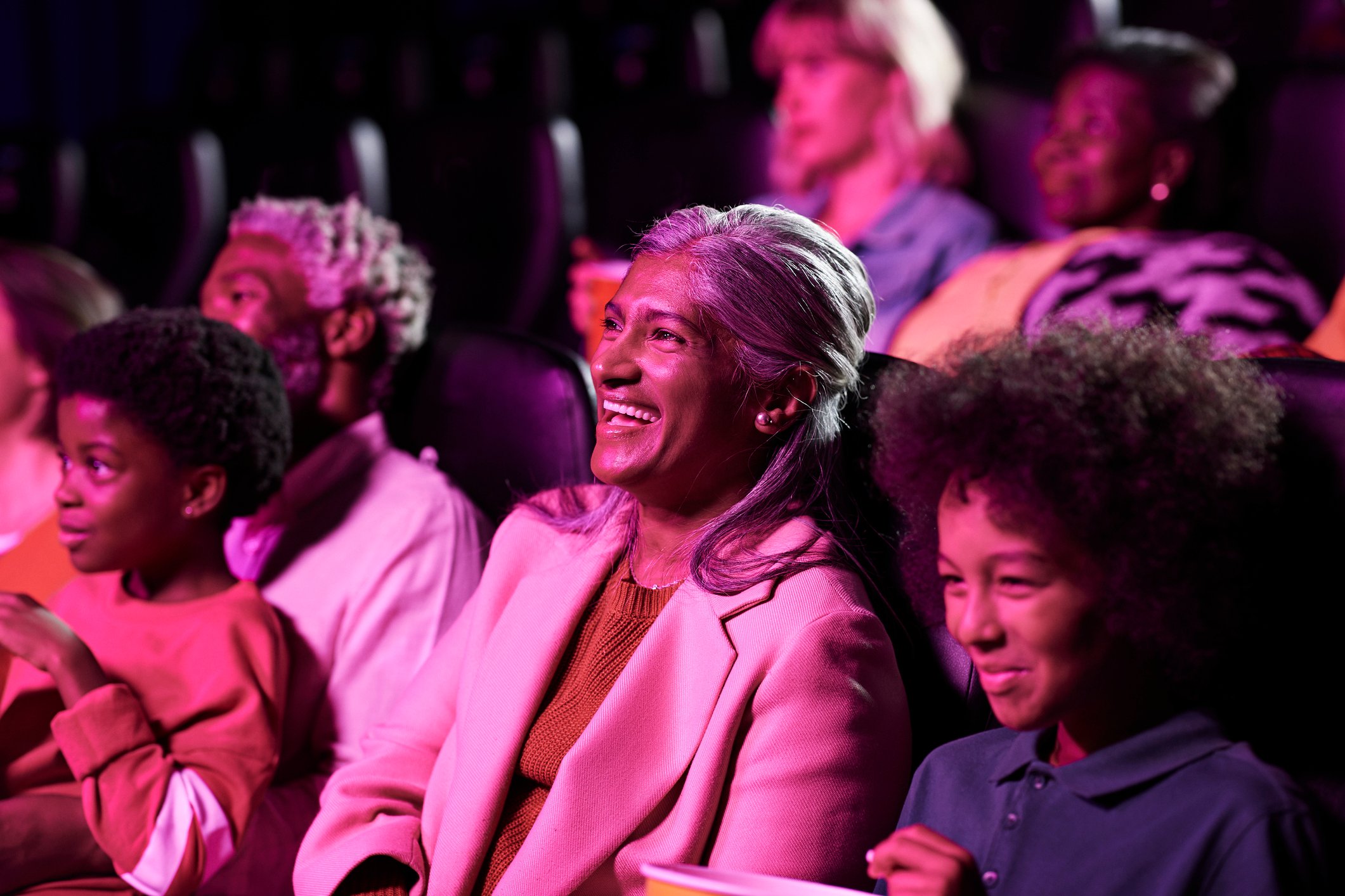 Folks inside a movie theater.