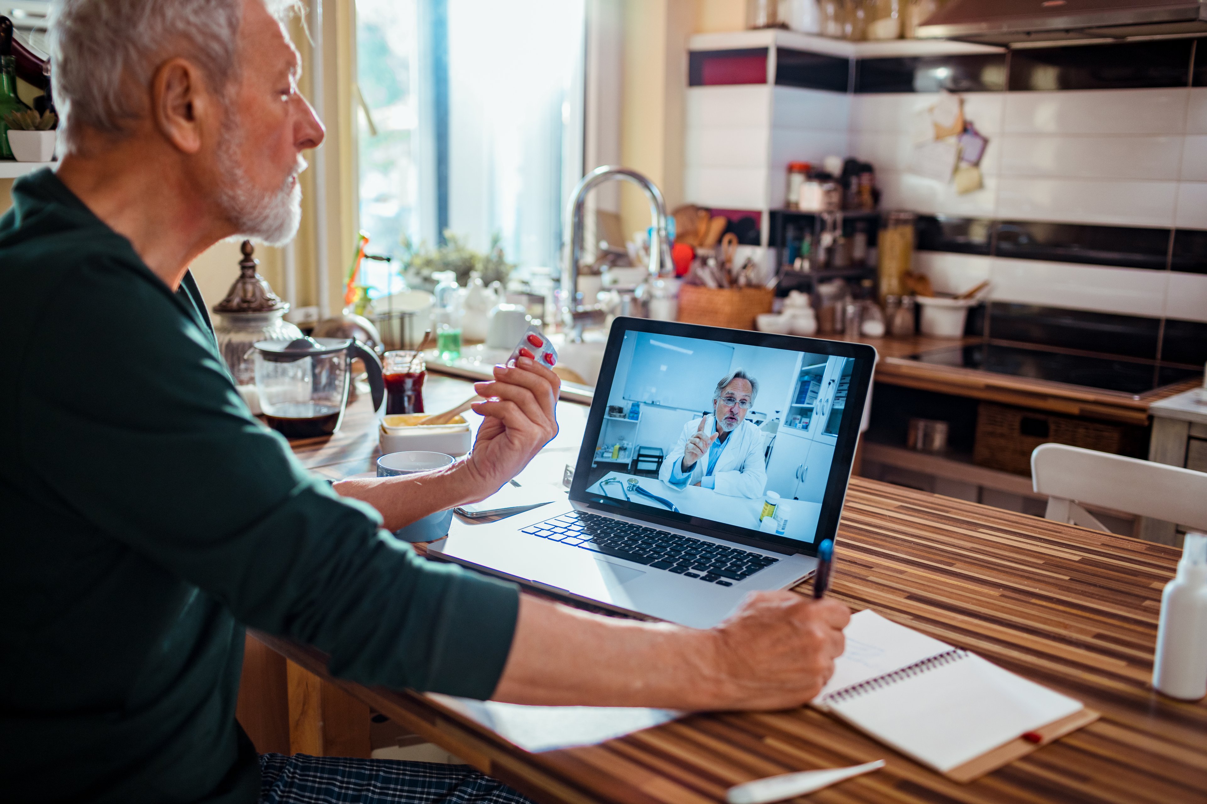 Person consulting a doctor about a prescription via videoconference. 