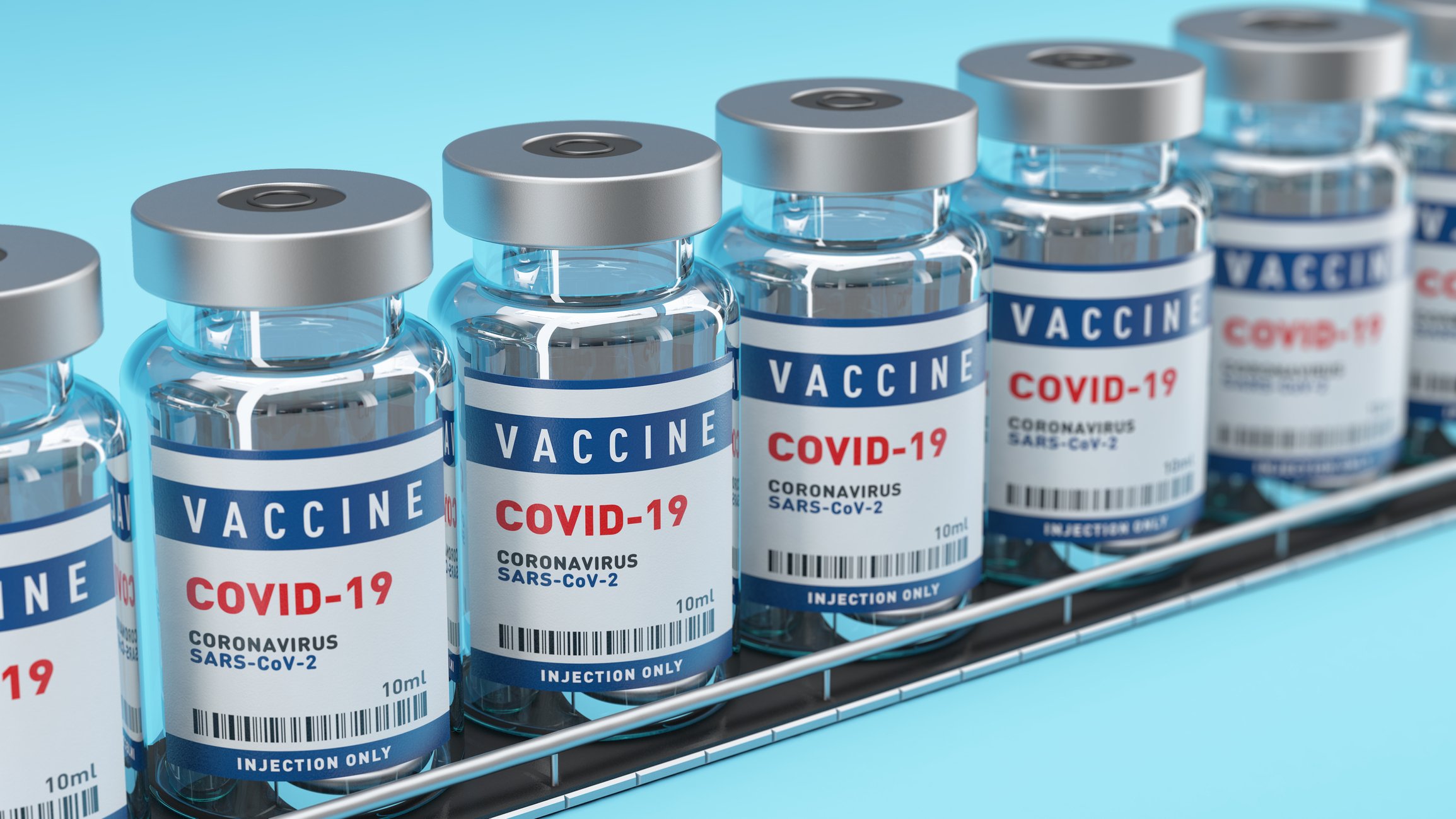 Seven COVID-19 vaccine vials.