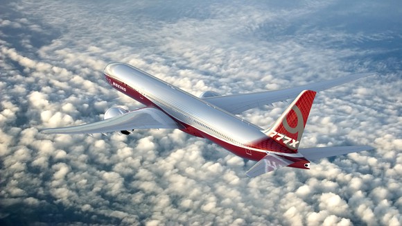A rendering of a Boeing 777-9 flying over clouds.