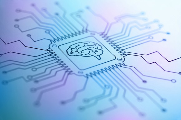 Cortex imprinted on computer chip set at the center of circuitry lines.