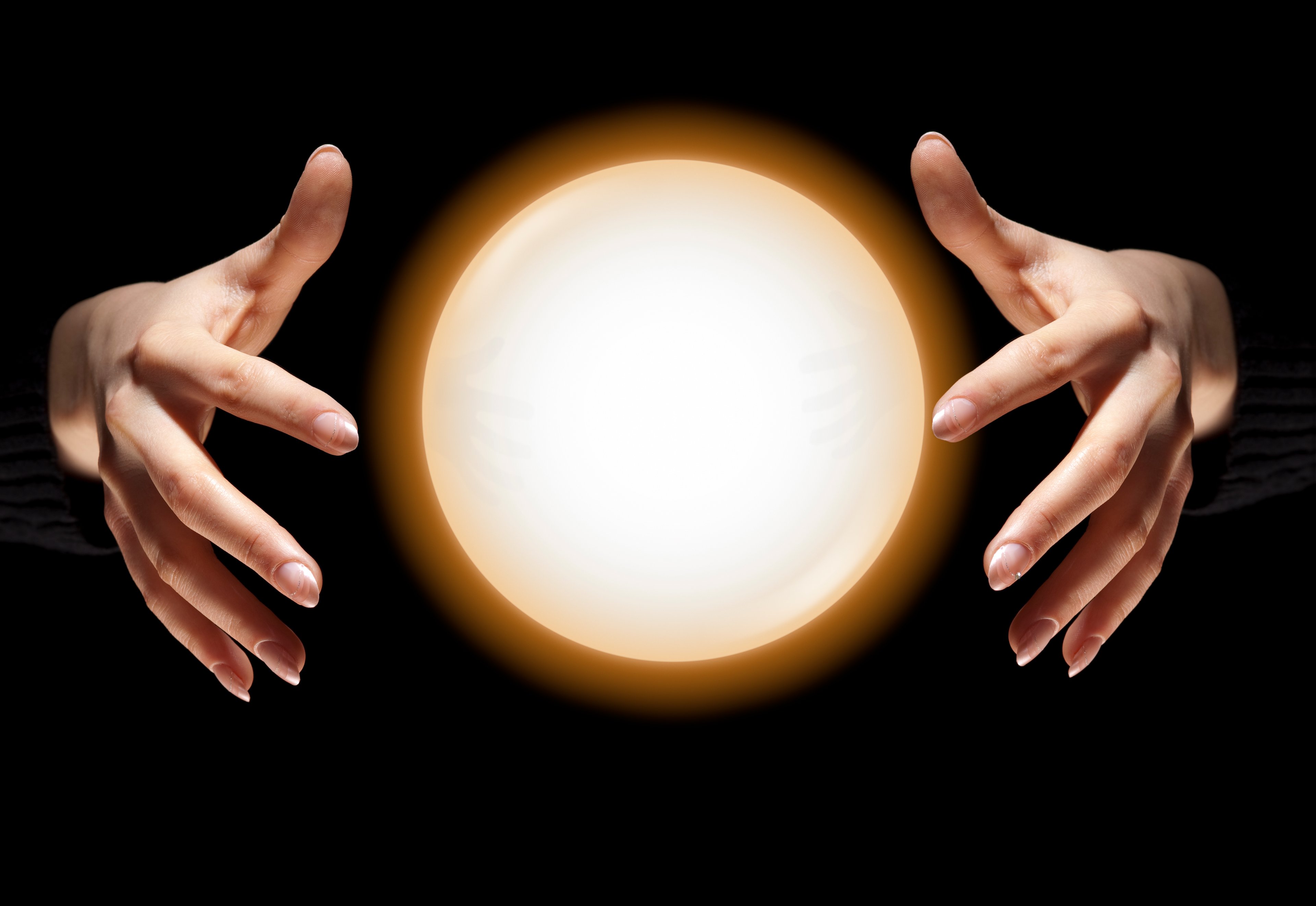 A crystal ball and hands