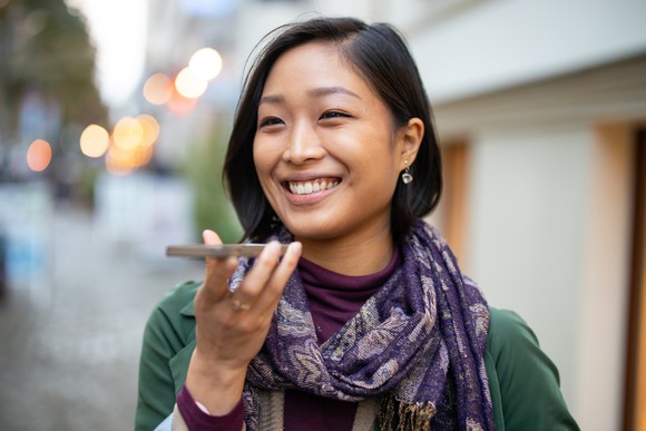 A woman holding a smartphone.
