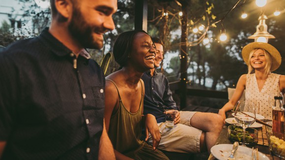 Several people at a dinner party.