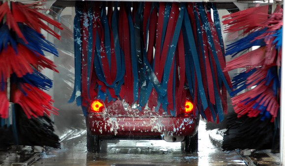 A car going through a car wash. 