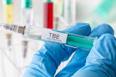 Medical professional holding TBE vaccination