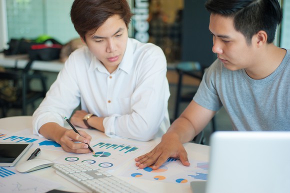 Two students looking at graphs.