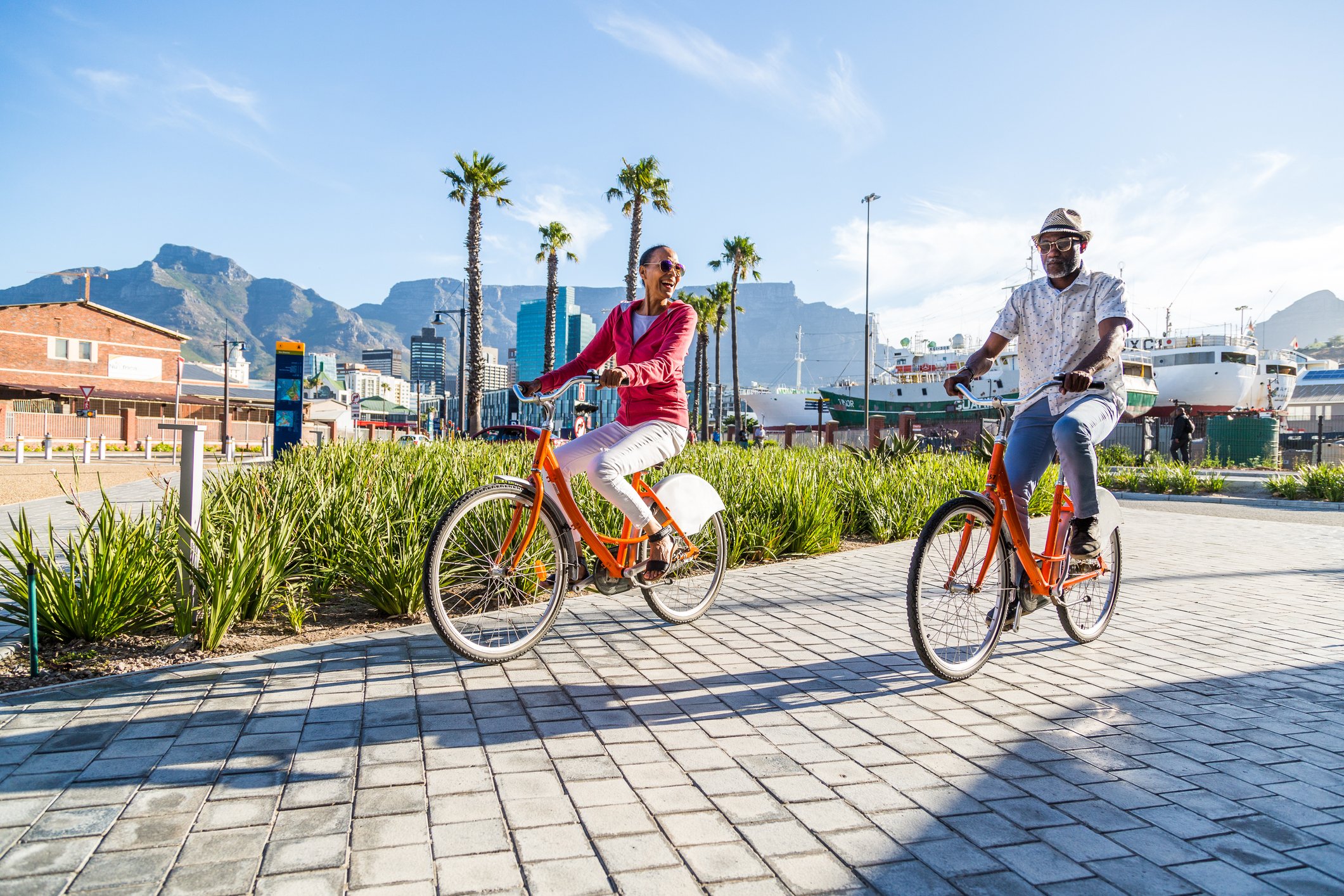 An older couple riding bicycles.
