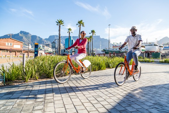 An older couple riding bicycles.