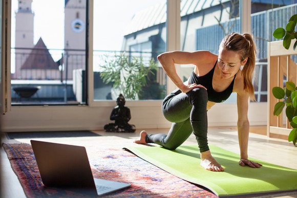A person practicing yoga at home.