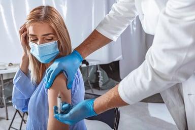 Woman receiving a vaccine shot