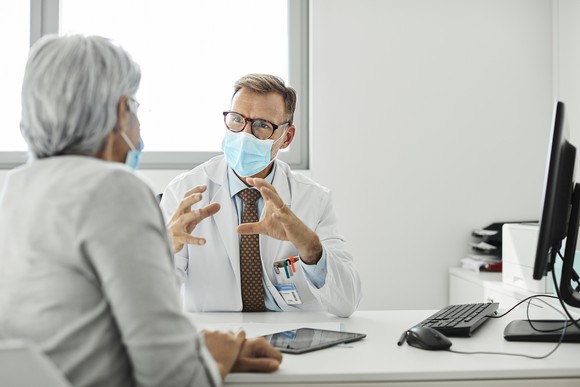 A patient meets with a doctor for an appointment.