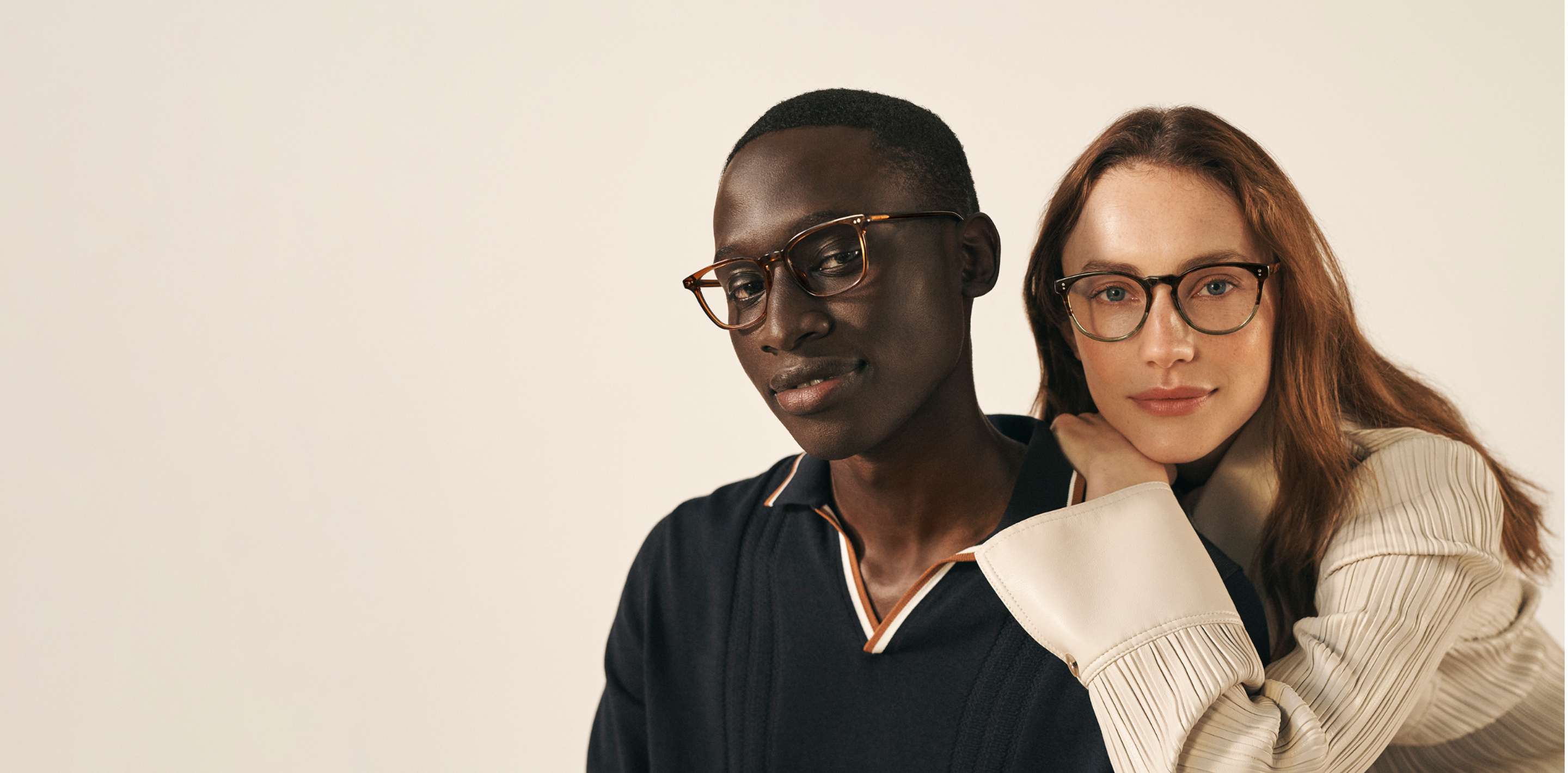Two people wearing glasses