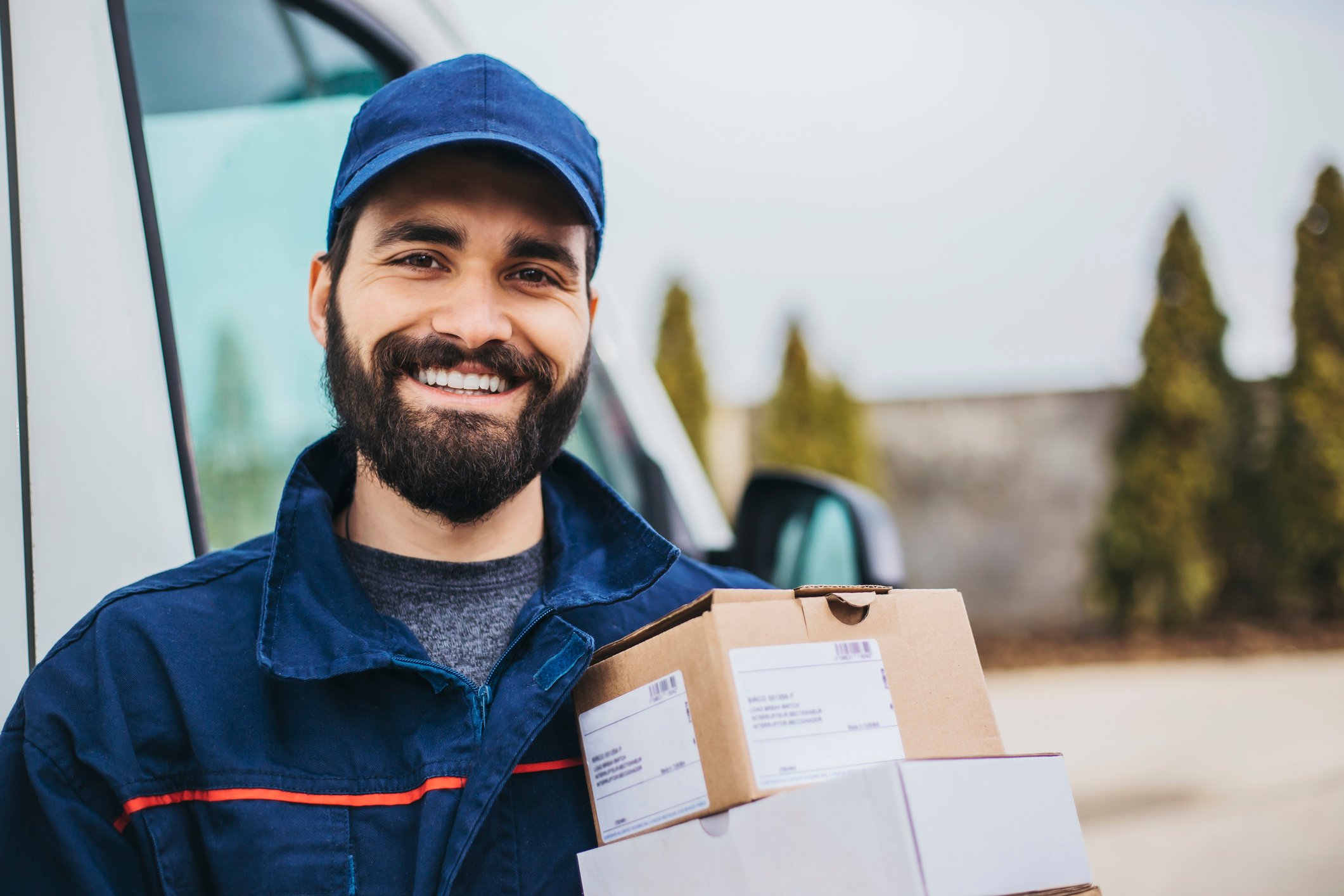 Person smiling while delivering packages