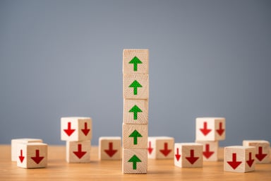 A stack of blocks with arrows pointing up.