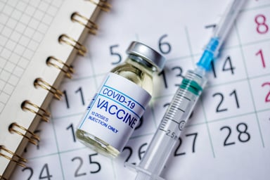 COVID vaccine on a calendar