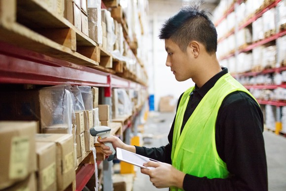 Warehouse worker scanning a package.