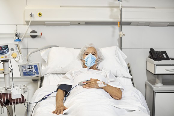 Patient in a hospital bed.