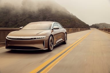 lucid air brown on road