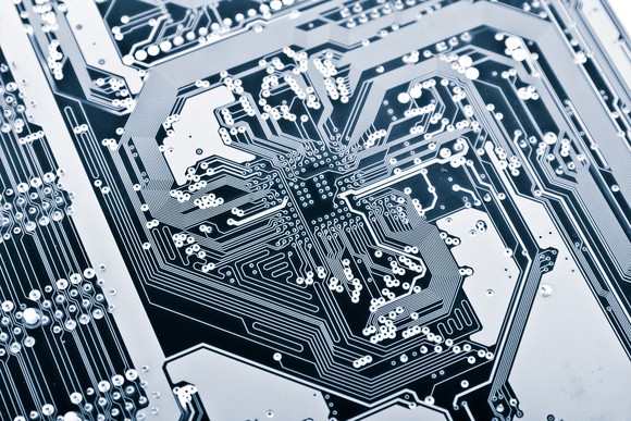 Closeup of transistors on a printed circuit board. 