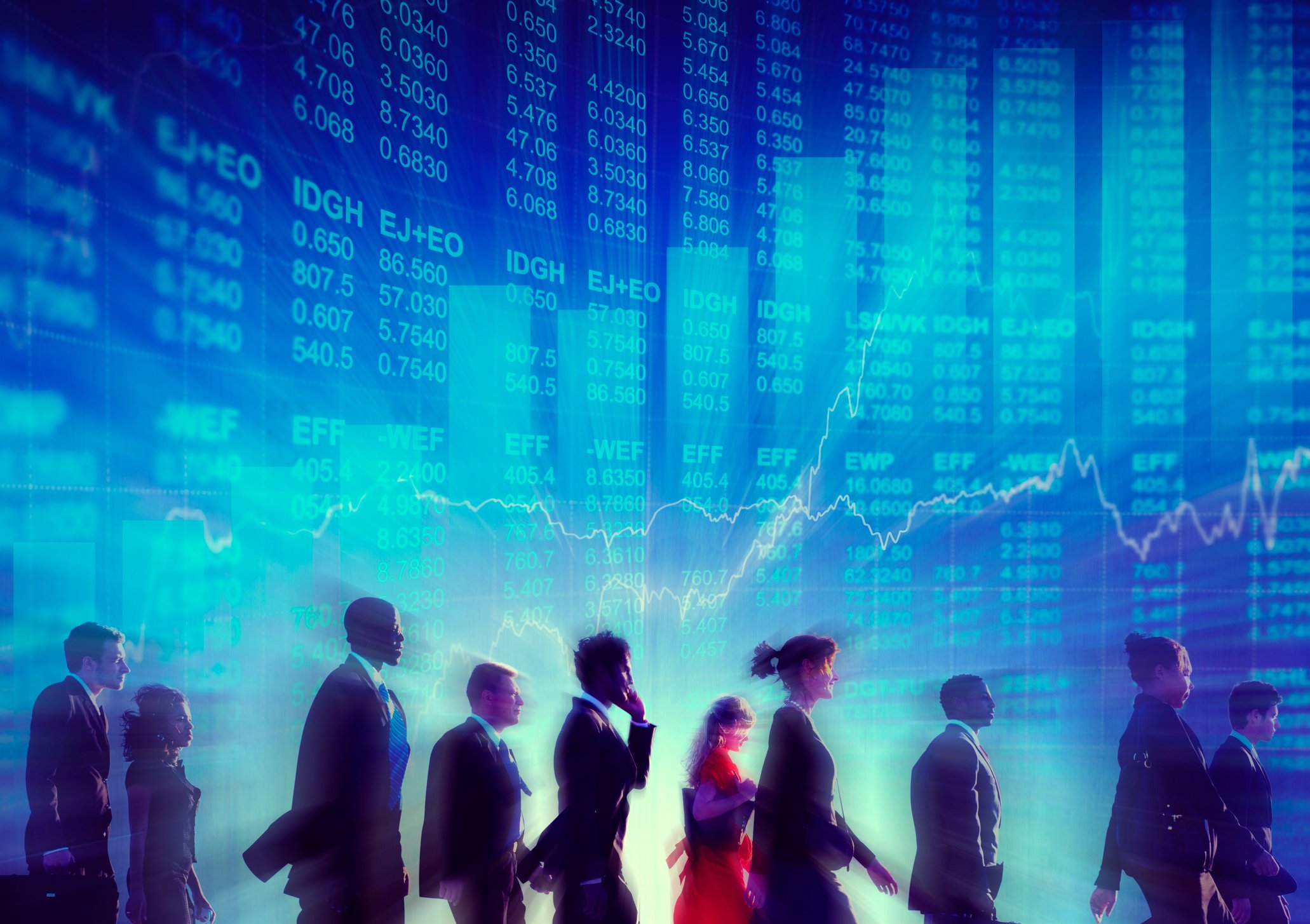 group of investors walking in front of wall with stocks and bar charts going higher.
