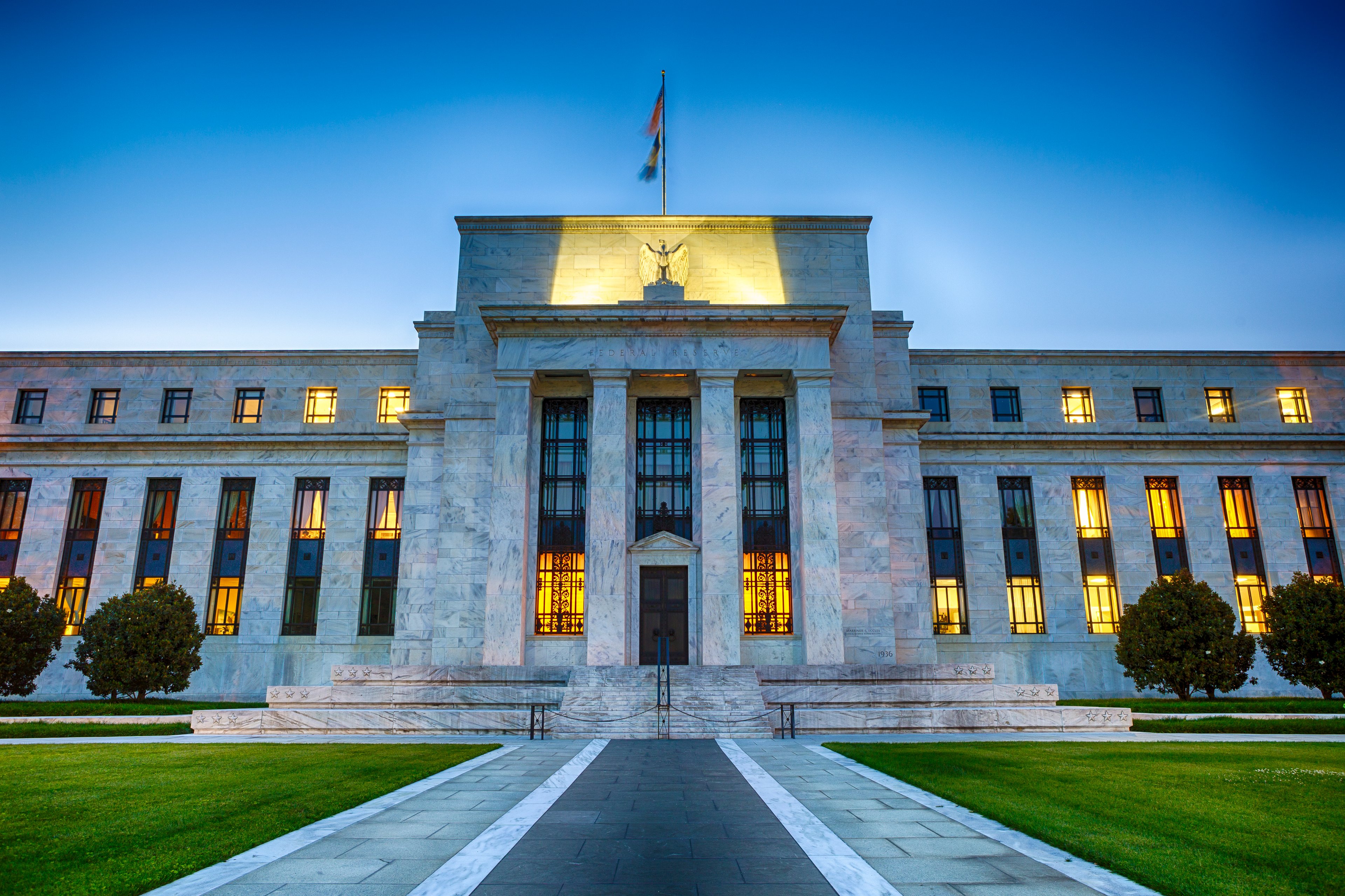 The U.S. Federal Reserve building in Washington D.C. at night. 