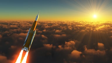 The sun and a rocket blasting above the clouds.