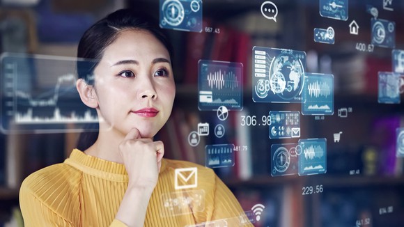 Woman standing amid superimposed images of screen shots.