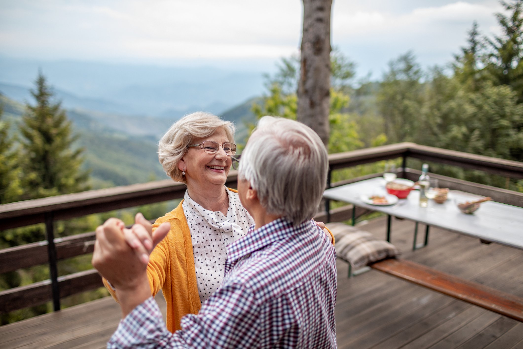 Elderly couple dancing together.