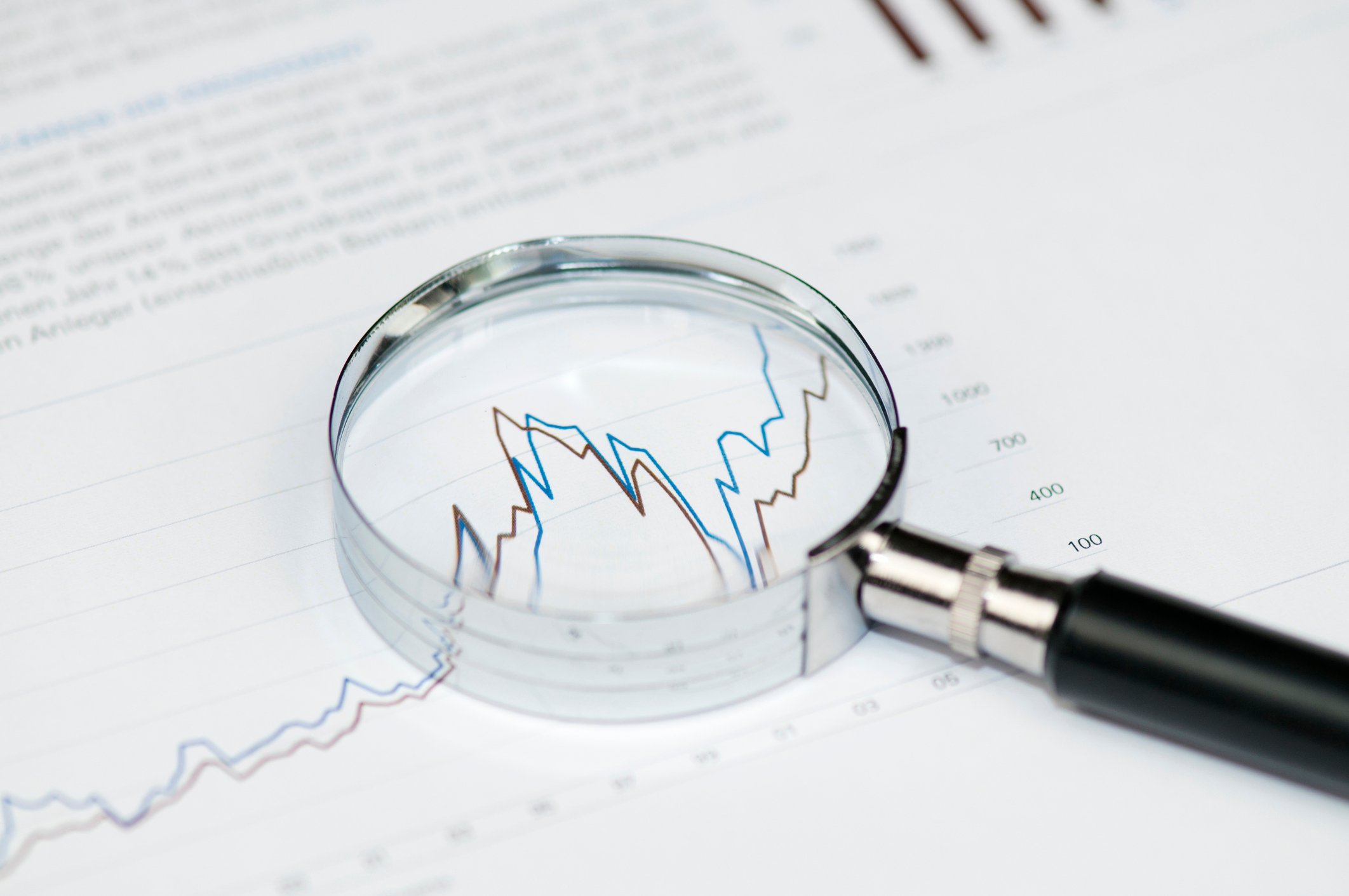 Magnifying glass on a stock chart