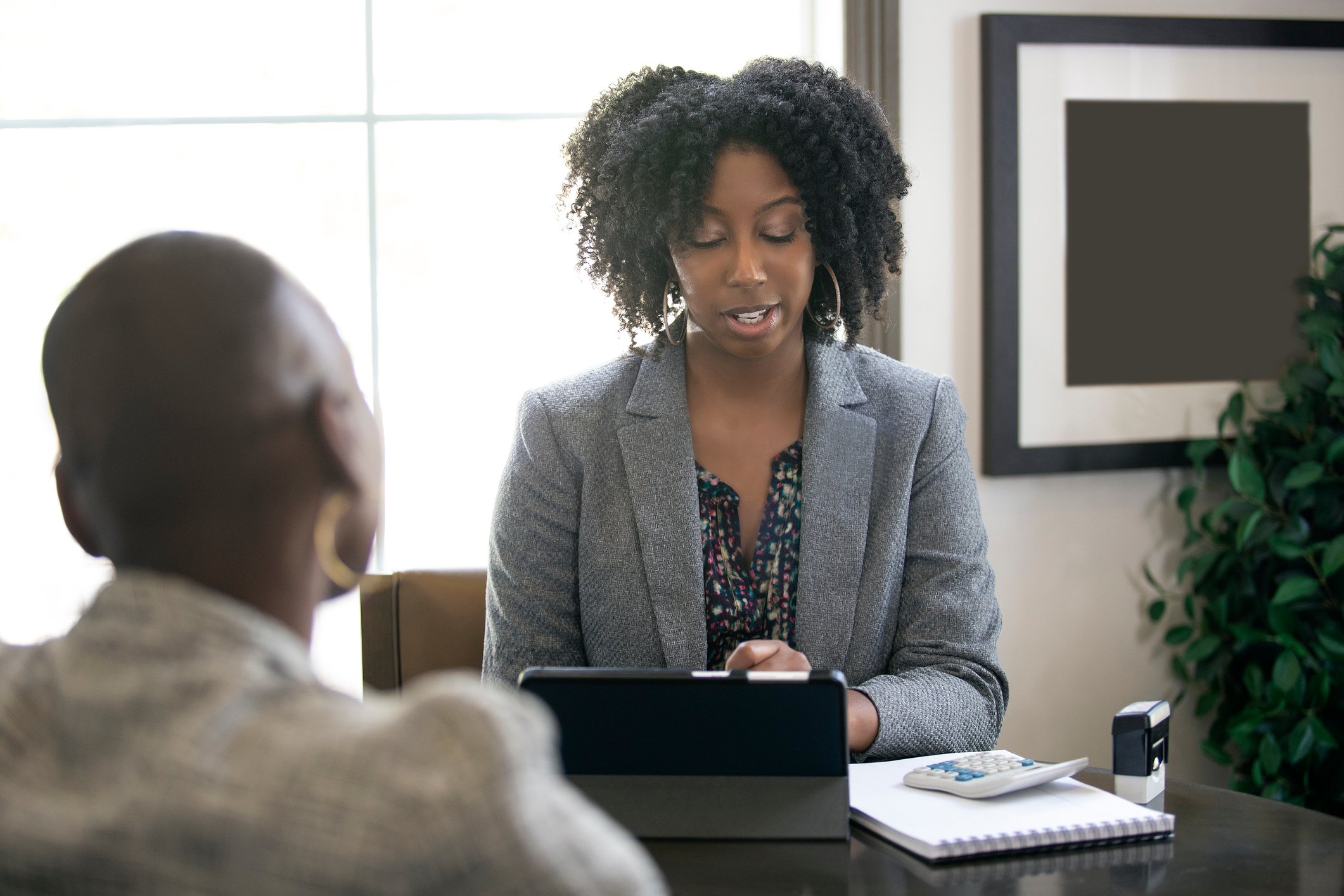 Person consulting another person with business affairs. 
