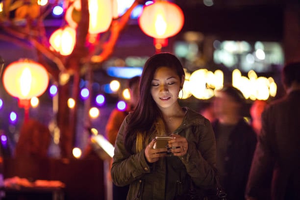 Young person watching video on their phone.