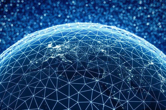 World at night with city lights and abstract connections.