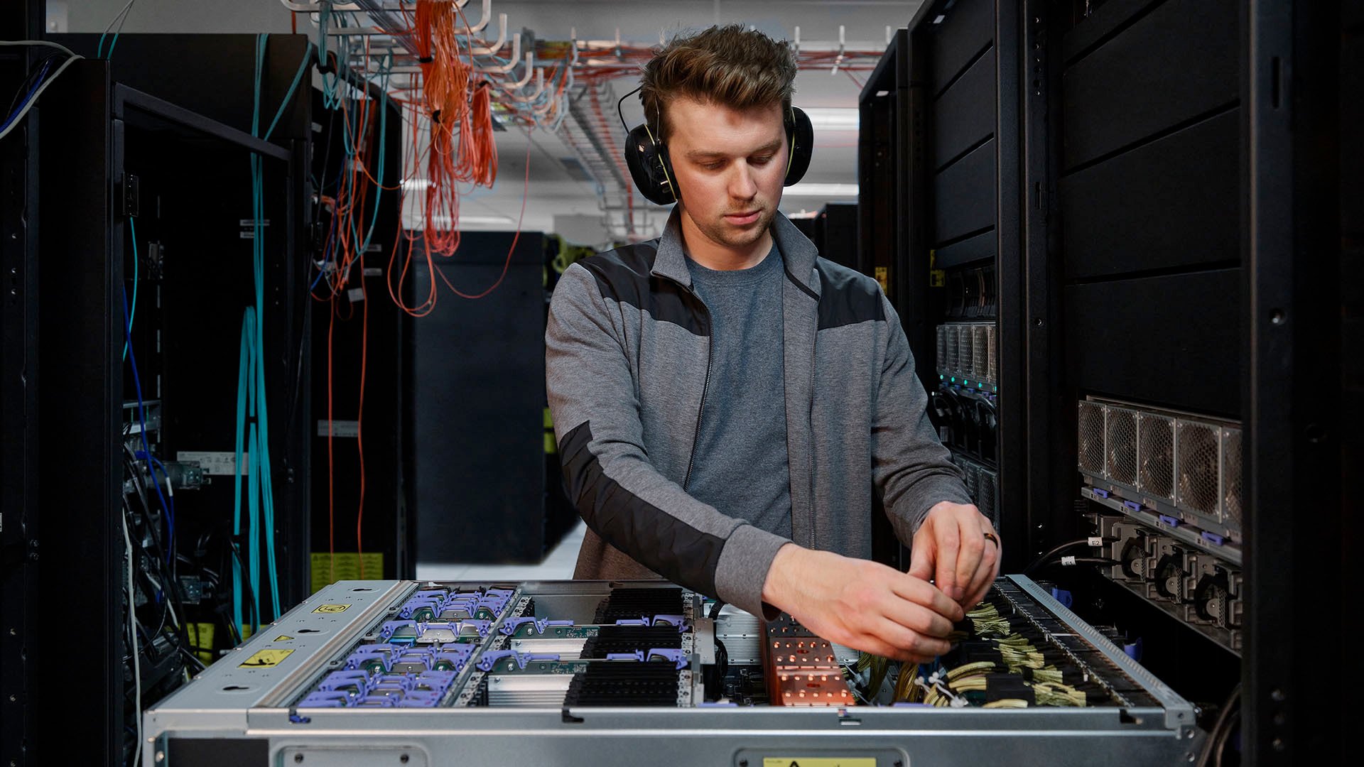 A person working on a Power E1080 server.