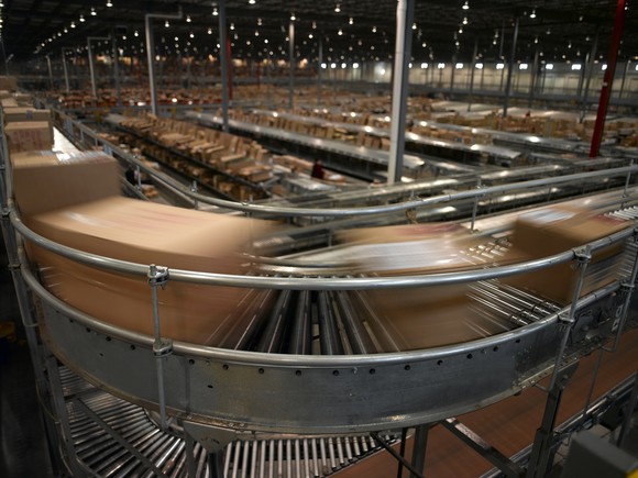 Packages flying by on high speed conveyor.