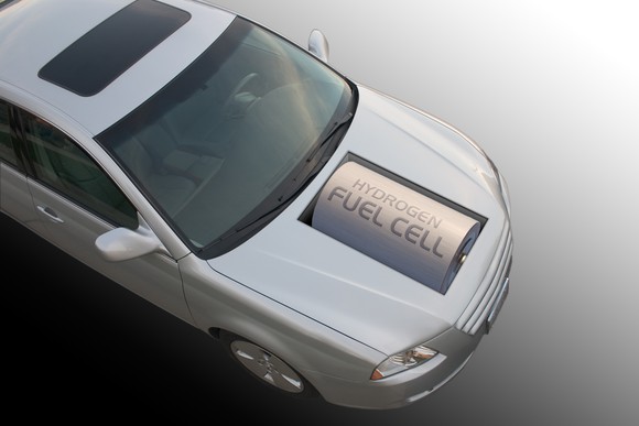 An automobile with a large battery in its hood that says "hydrogen fuel cell."