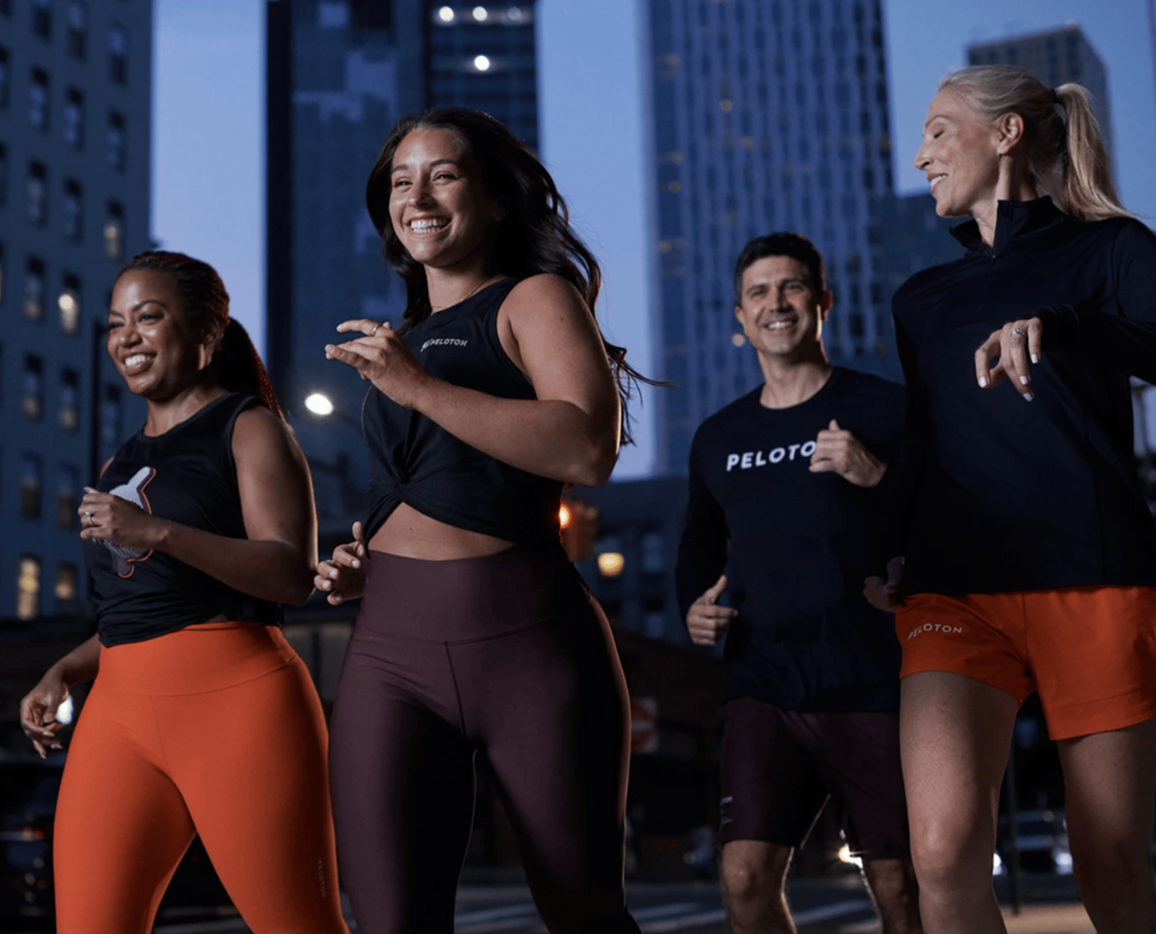 People are jogging while wearing Peloton Apparel. 