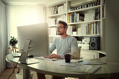Man Using Computer at Home