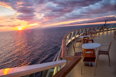 The deck of a cruise ship at dawn or dusk
